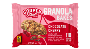 A Chocolate Cherry Granola Bake bar by Cooper Street Snacks. Package shows a whole grain bar loaded with real Michigan cherries, buckwheat, chia seeds, flax seeds, quinoa, and whole rolled oats.