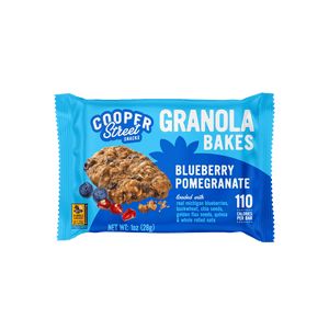 A Blueberry Pomegranate Granola Bake bar by Cooper Street Snacks. Package shows a whole grain bar loaded with real Michigan blueberries, buckwheat, chia seeds, flax seeds, quinoa, and whole rolled oats.