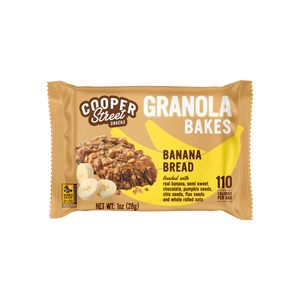 A Banana Bread Granola Bake bar by Cooper Street Snacks. Package shows a whole grain bar loaded with real bananas, semi sweet chocolate, pumpkin seeds, chia seeds, flax seeds, and whole oats.
