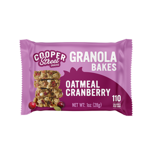An Oatmeal Cranberry Granola Bake bar by Cooper Street Snacks. Package shows a whole grain bar loaded with real Michigan cherries, pumpkin seeds, buckwheat, chia seeds, flax seeds, and quinoa. 
