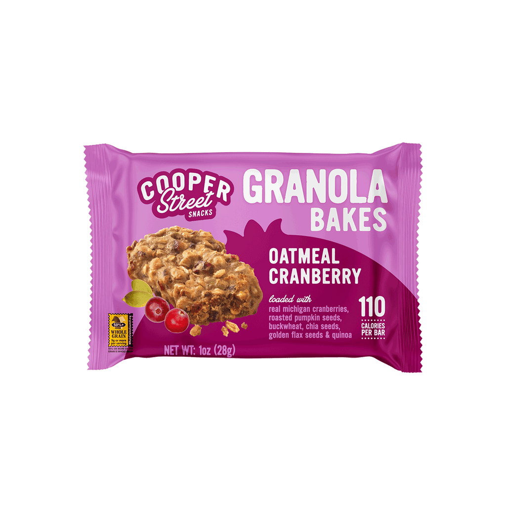 An Oatmeal Cranberry Granola Bake bar by Cooper Street Snacks. Package shows a whole grain bar loaded with real Michigan cherries, pumpkin seeds, buckwheat, chia seeds, flax seeds, and quinoa. 
