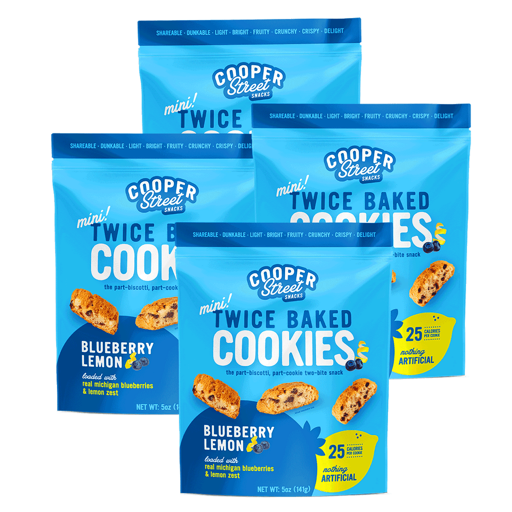 Four packages of Blueberry Lemon Twice Baked Cookies by Cooper Street. Each mini cookie is 25 calories and loaded with real Michigan blueberries and lemon zest.
